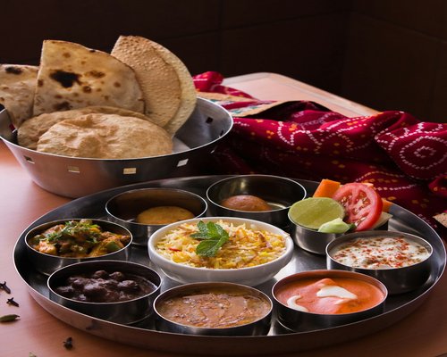 Traditional Indian Thali with multiple bowls of vegetables and dal