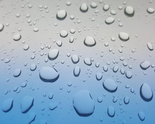 A glass of water reflecting clear light