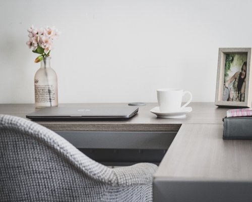 A person enjoying fresh fruits at work desk