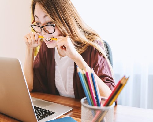 Person stretching at office desk